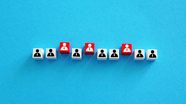 istock Employee figures with some highlighted in red. Staff selection. 2236135606