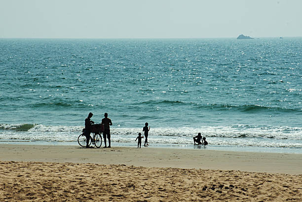 October 31, 2021, Uchinada Town, Kahoku District, Ishikawa Prefecture, Japan People enjoying a walk or cycling on Uchinada Beach near Kanazawa City as the sunset shines beautifully