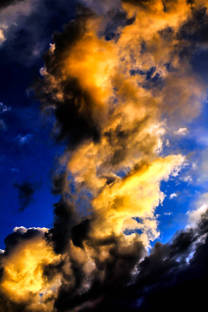 istock A breathtaking display of orange and yellow clouds 2236149929