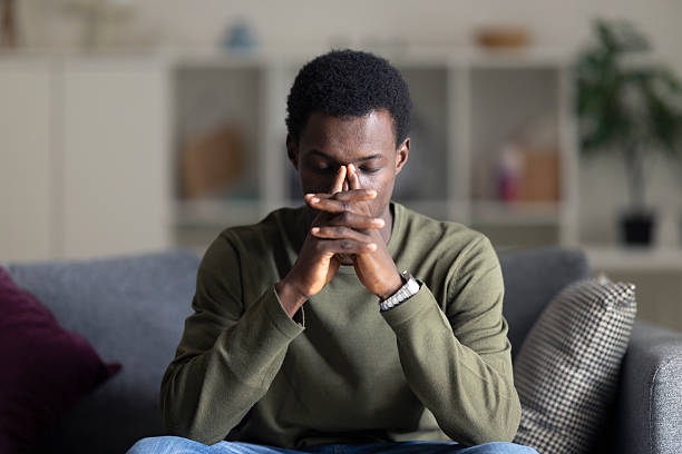istock Young black man suffering from stress, anxiety, thinking about mental health problems 2236149957