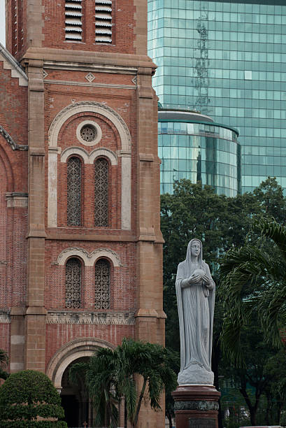 Ho Chi Minh City, Vietnam - September 15, 2015: Magnificent heritage, Notre-Dame Cathedral Basilica of Saigon, Our Lady of Immaculate Conception in downtown. Virgin Mary statue in front of church