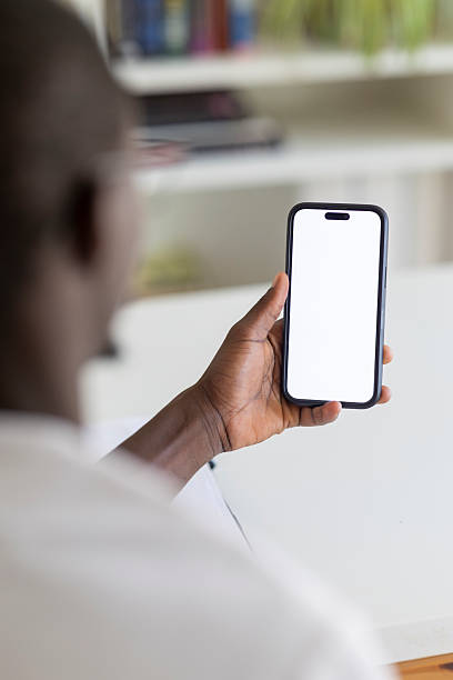istock Person holding a mobile phone, displaying blank screen for app, text, or social media 2236151869