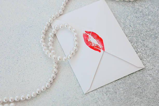 Cute girl writing a love card for her boyfriend