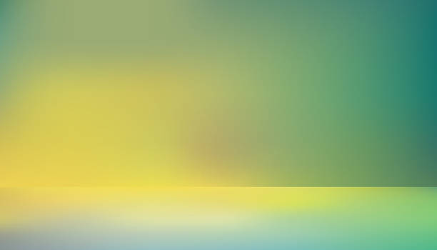 istock A vibrant and blurred abstract studio background with a gradient of yellow, green, and blue hues, perfect for product display or creative design. 2236155453