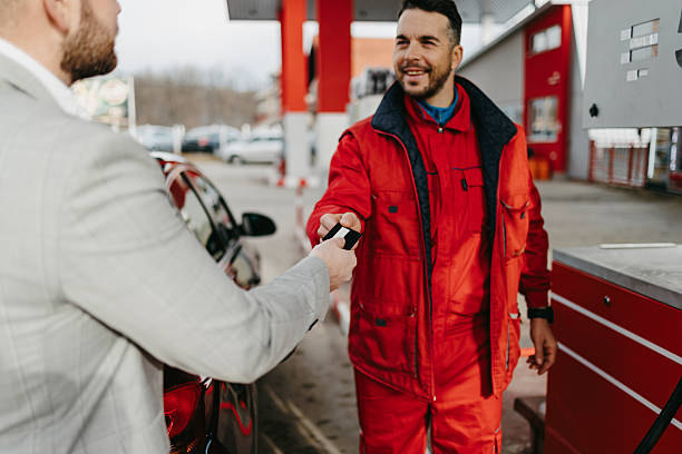 istock Gas station worker processing credit card payment 2236156034