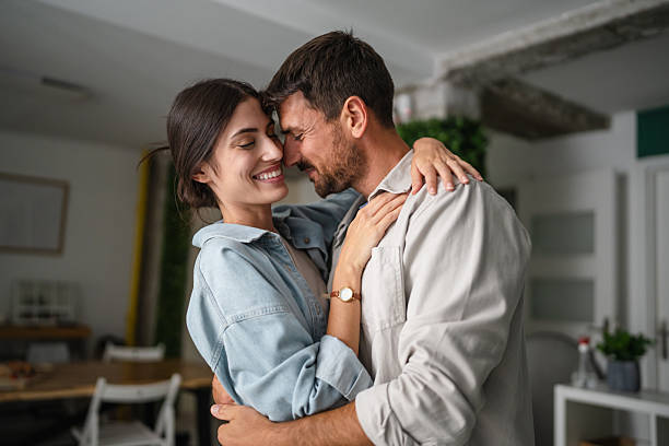 istock Happy young couple embracing at home 2236158377