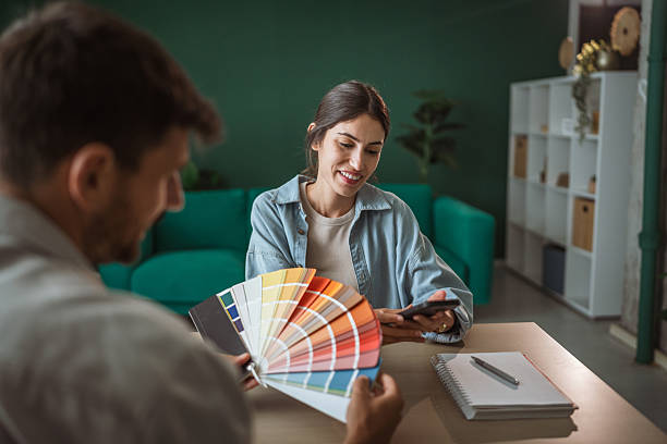 istock Couple choosing home interior colors using color palette 2236159730
