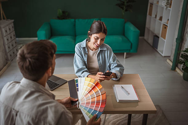istock Couple choosing home interior colors using color palette 2236159913