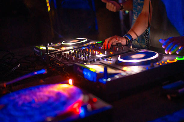 istock Two young dj's playing techno music on the concert stage 2236164196