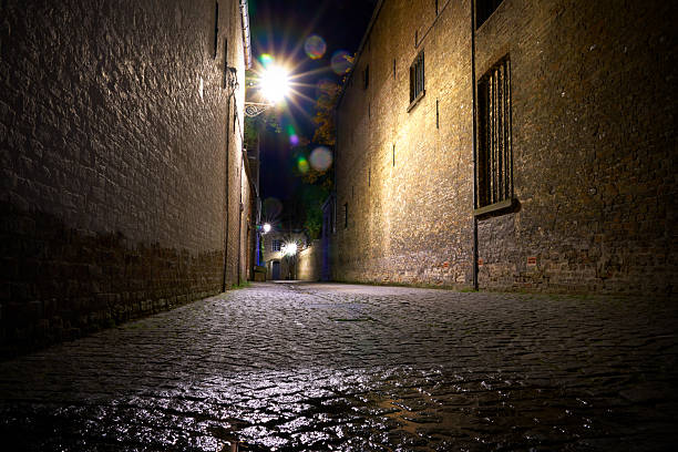 istock Dark Cobblestone Alley at Night Bruges 2236168347