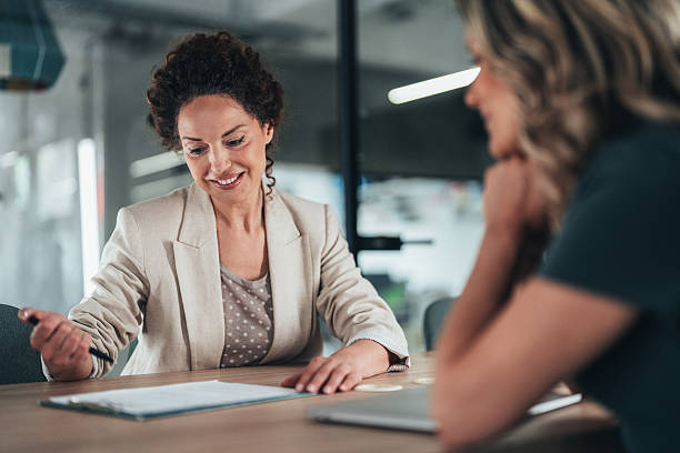 istock Professional discussion between advisor and client and successful signing of contract 2236169480
