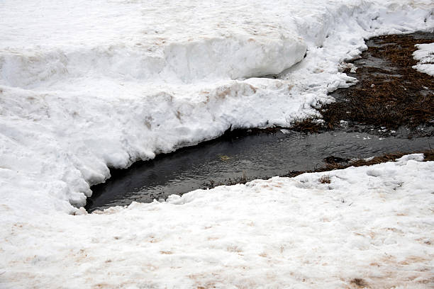 A narrow stream cuts through a snow-covered landscape at the Perisher Valley, Snowy Mountains, New South Wales, Australia. (Photo by Tara Chand Malhotra)