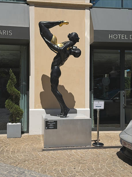 Lots of  multi-colored globules and bubbles forms a male human figure. A man is dancing on a black background. A three dimensional digitally generated picture