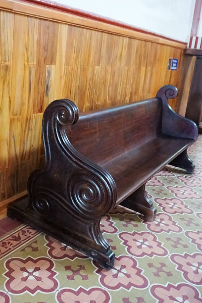 istock Ancient church bench carved in wood 2236175639
