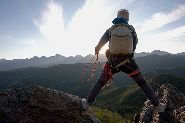Hiker on the top of the mountain peak.