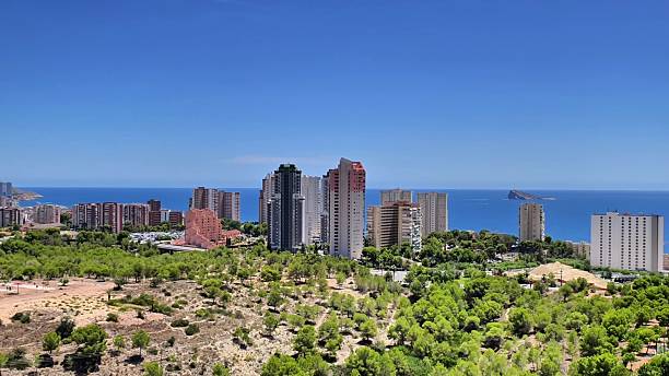 istock Experience a stunning coastal view featuring a vibrant urban skyline, complemented by lush greenery 2236180820