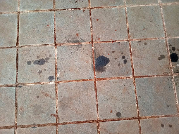 istock Dirty Tiled Floor with Oil Stains 2236181061