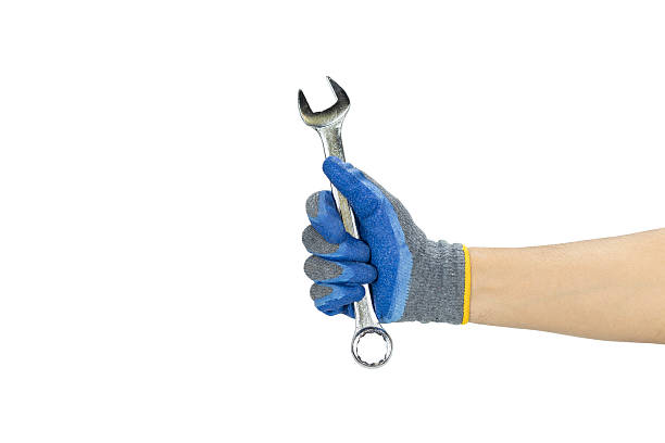 istock Metal adjustable wrench in blue work glove isolated on white background with clipping path 2236181281