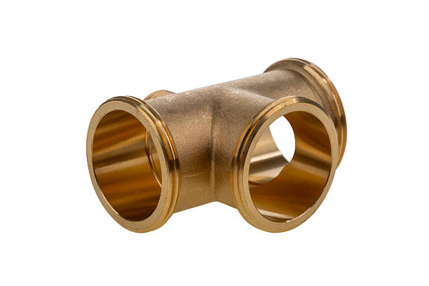 Golden Four-way valve on white background