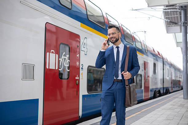 istock Young businessman commuting and talking on his phone 2236187481