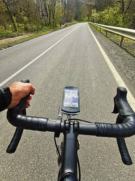 istock Road Cycling POV. Hands On Handlebar With Bike Computer Navigation 2236187566