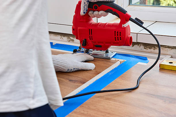 istock man with electric jigsaw cutting hole in the kitchen countertops 2236187723