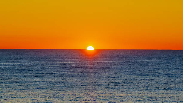 istock Sunrise at the seaside with a cloudless sky 2236195239
