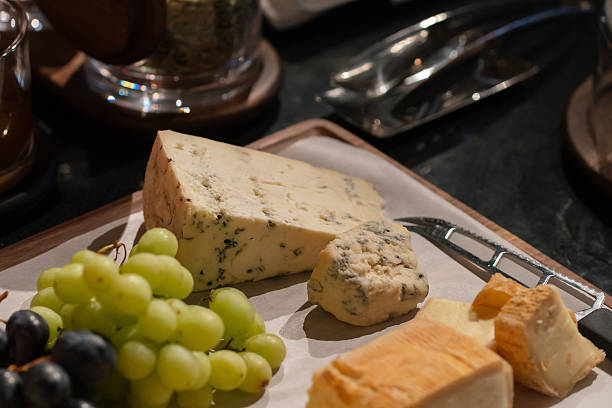 Slices of cheese with grapes at a buffet