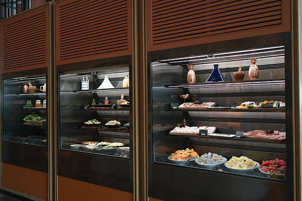 istock Buffet cold corner with assorted appetizers, salads, and cold dishes arranged on multiple shelves. 2236195440