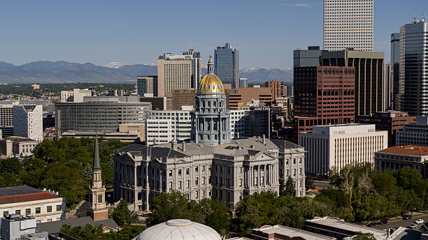 istock Denver skyline featuring Colorado State Capitol building with Rocky Mountains backdrop. Downtown financial district and historic architecture viewed from Capitol Hill. 2236196561