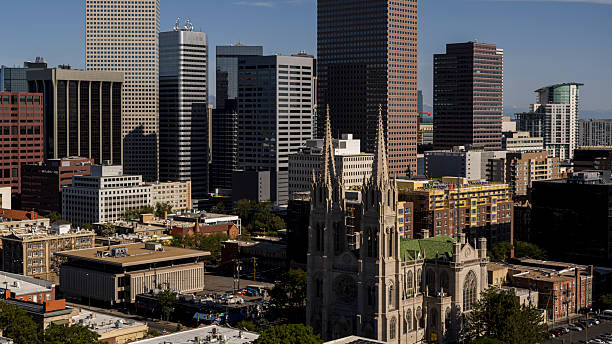 istock Cathedral Basilica of the Immaculate Conception standing amid modern skyscrapers in the downtown Denver skyline, showcasing a blend of historical and contemporary architecture in Colorado. 2236196562