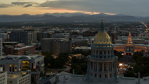 istock Mountain backdrop frames Capitol Hill district at dusk. Colorado State Capitol and Civic Center buildings illuminated against Rocky Mountain silhouette in Denver, Colorado. 2236196857