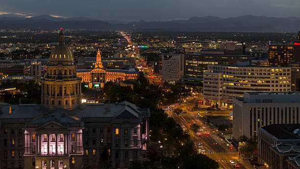 istock Cityscape featuring illuminated Capitol Complex and Denver Post building. High angle view of downtown Denver with Rocky Mountains backdrop at twilight. 2236196970