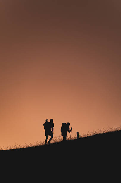istock Hikers in silhouette walking uphill at sunset, Nockspitze, Austria 2236197534