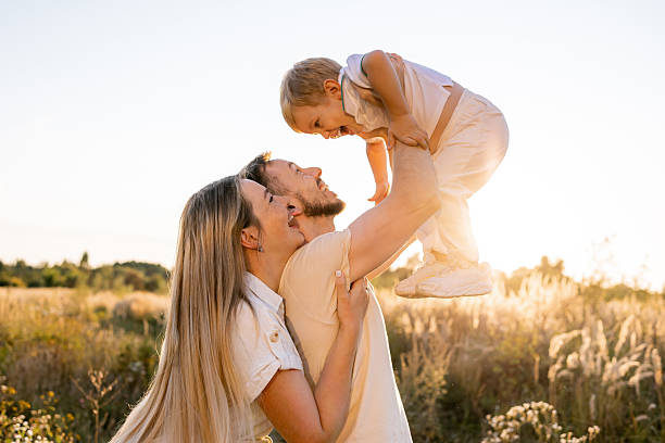 Happy family spending quality time outdoors during a beautiful golden hour evening