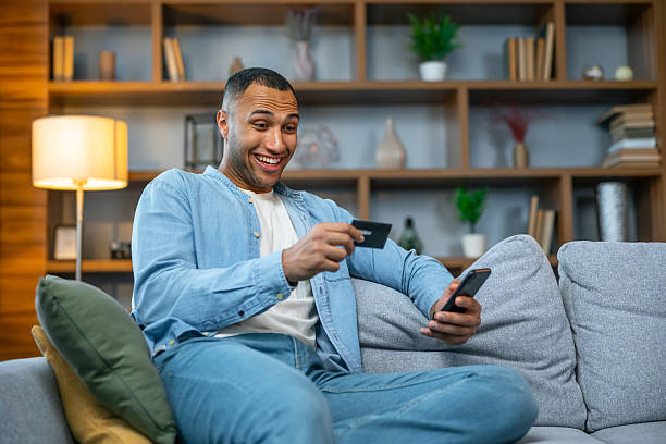 istock Young happy freelancer receive payment, check card balance working from home. 2236200622