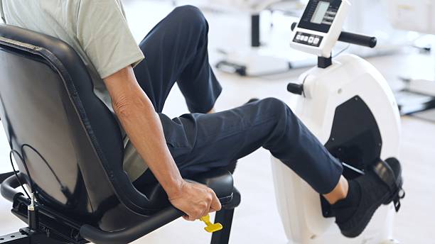 istock Asian elderly people exercising on recumbent bikes 2236201593