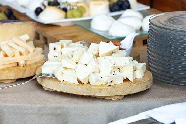 istock Buffet table presenting variety of delicious cheeses with grapes and bread 2236203475