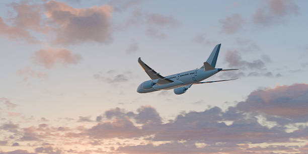 istock White passenger airplane flying in the sky amazing clouds in the background. 3d render. 2236203765