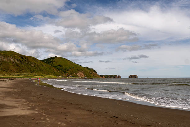 istock Sandy coastal beach with rolling waves and hills 2236206762