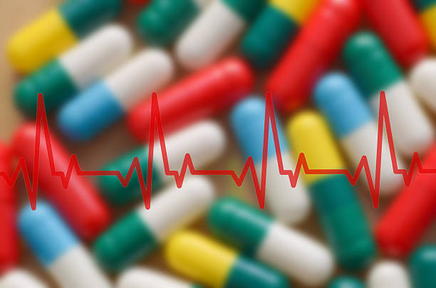 istock A red EKG line showing a normal heart rhythm is superimposed over a blurred background of colorful pills, symbolizing the management of heart conditions through pharmaceuticals. 2236207287