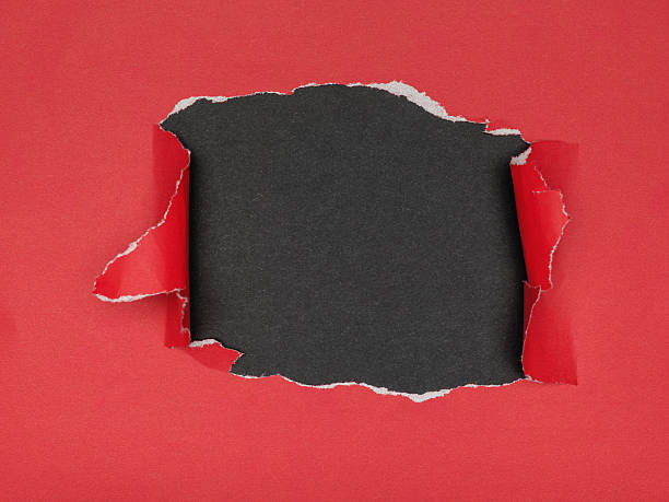 istock Red Paper Torn Revealing Black Background 2236209206