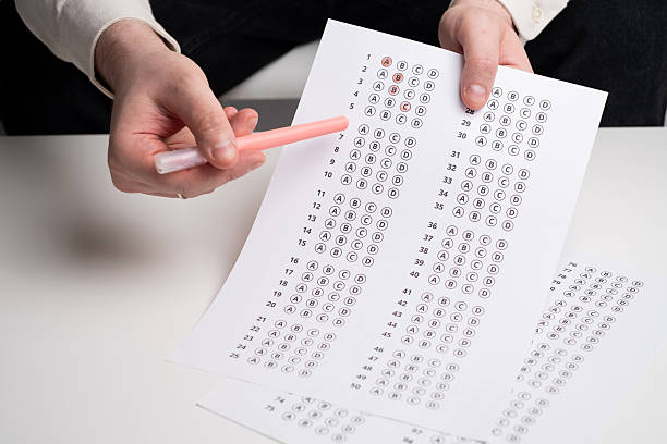 istock Admission test. Examination form. Choosing the correct answer. A sheet of paper with a test task. School exam. University quiz. Right or wrong option. Student to study. Elementary school question 2236212396