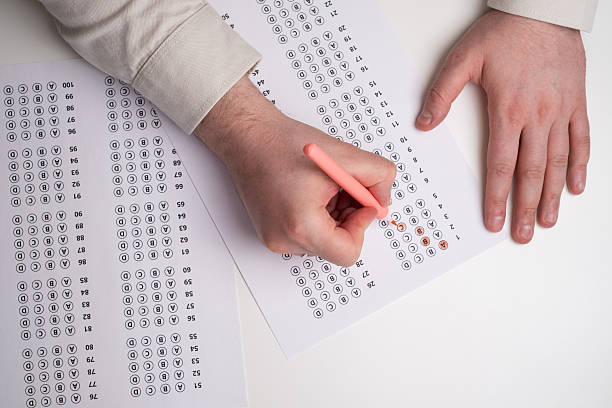 istock Admission test. Examination form. Choosing the correct answer. A sheet of paper with a test task. School exam. University quiz. Right or wrong option. Student to study. Elementary school question 2236212524