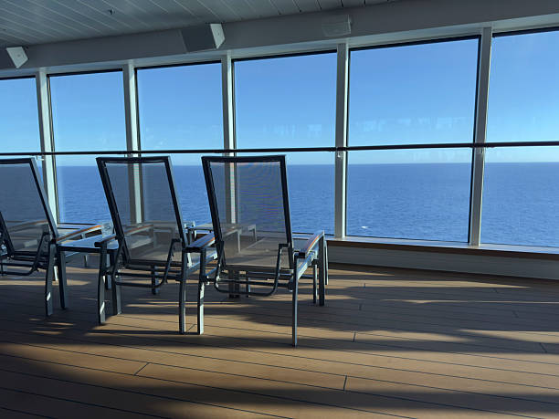Scenic Ocean View From Indoor Lounge With Relaxation Chairs under Sunlight