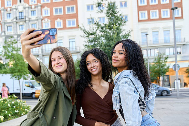istock Three young women taking a selfie in the city 2236217401