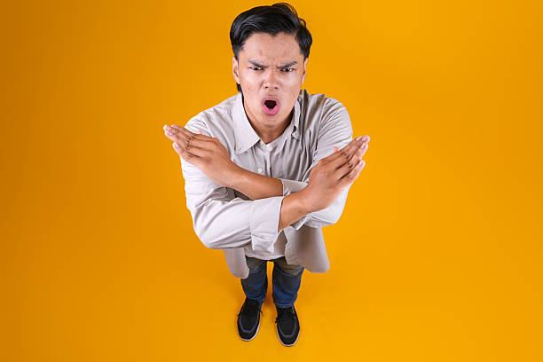 istock Young Male Crossing Hands Gesture Rejection 2236219847