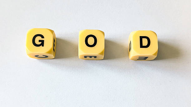 istock Yellow cubes with word GOD separated by gaps on white background 2236222260
