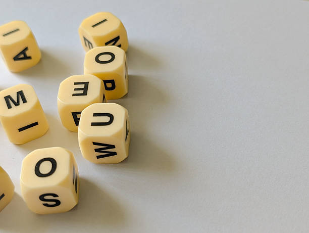 istock Scattered letter cubes on gray background with space for text 2236222289