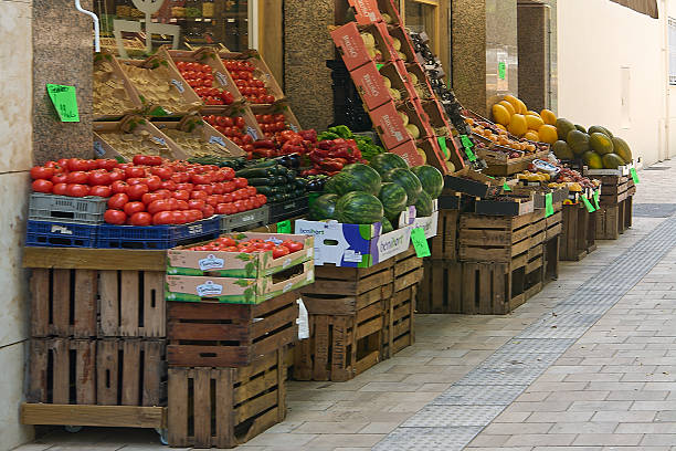 Viladecans. Barcelona - September 15, 2025: A close-up view of a street stall filled with a wide variety of colorful produce, showcasing the freshness and quality of items available at a traditional